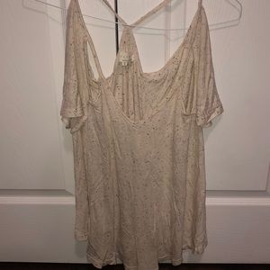 Flutter by dance and marvel off the shoulder top